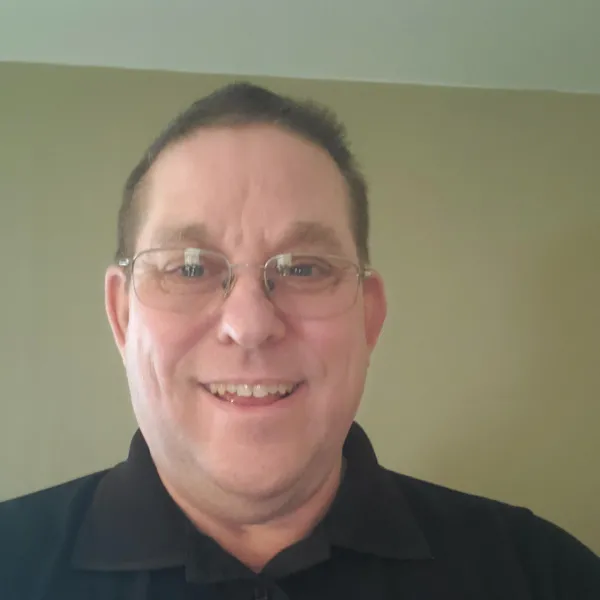 Steve Karber, man with glasses and a black shirt.